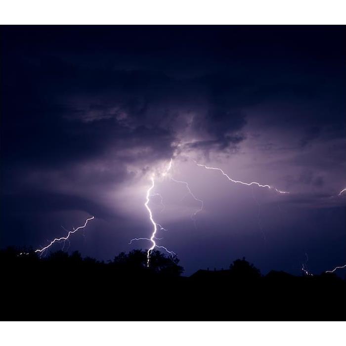 < img src =”lightning.jpg” alt = "multiple lightning strikes off in distance of dark purple night sky " >