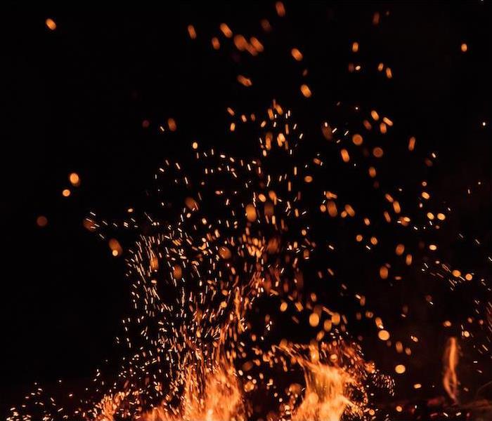 a close up view of a bright campfire burning at night